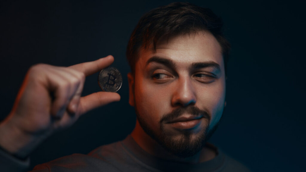 man holding bitcoin financial ecosystem the curr 2023 11 27 05 02 10 utc scaled e1731919248491