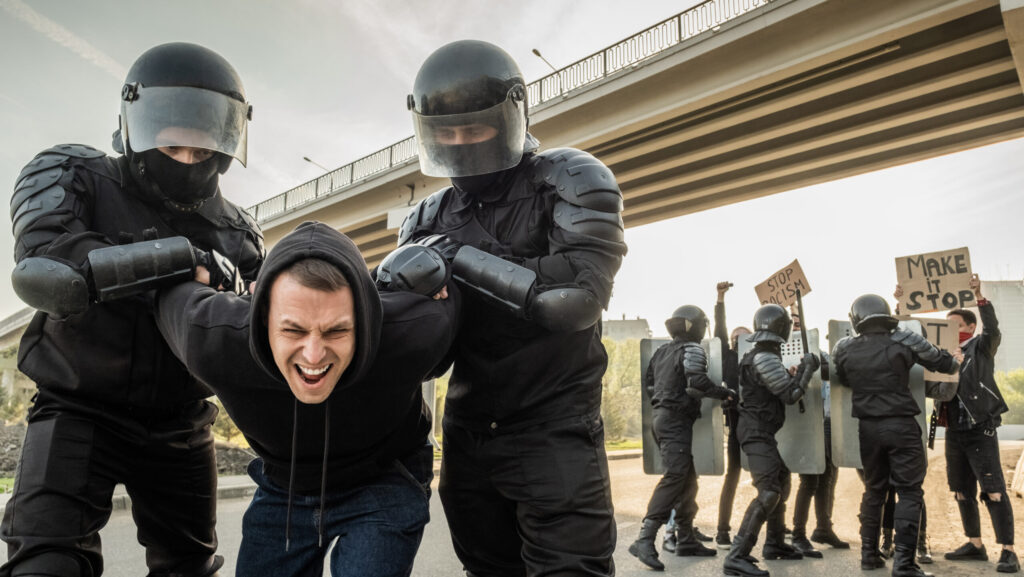 riot officer stopping protester 2023 11 27 05 11 25 utc scaled e1730444155452