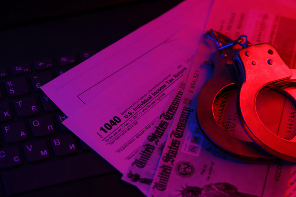 us tax refund check and handcuffs on computer keyb 2024 07 29 18 57 23 utc